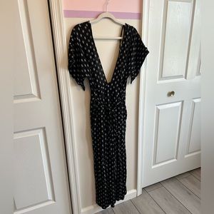 Women’s size Medium Jumpsuit. SUPER flattering and low cut front—